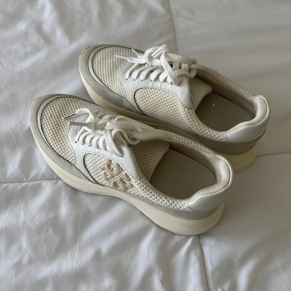 Cream sneakers gently worn